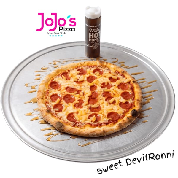 JoJo's Pizza "Sweet DevilRonni" pizza with pepperoni, pineapple, and hot honey drizzle on a metal tray.